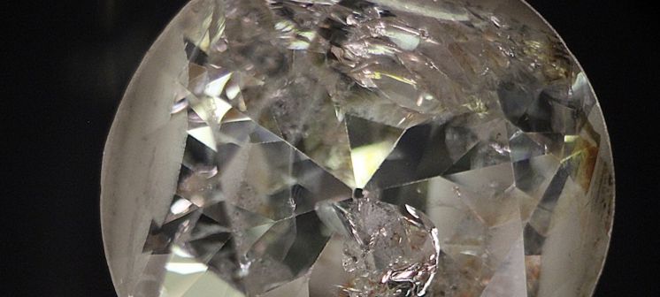 Included diamond with internal blemishes.