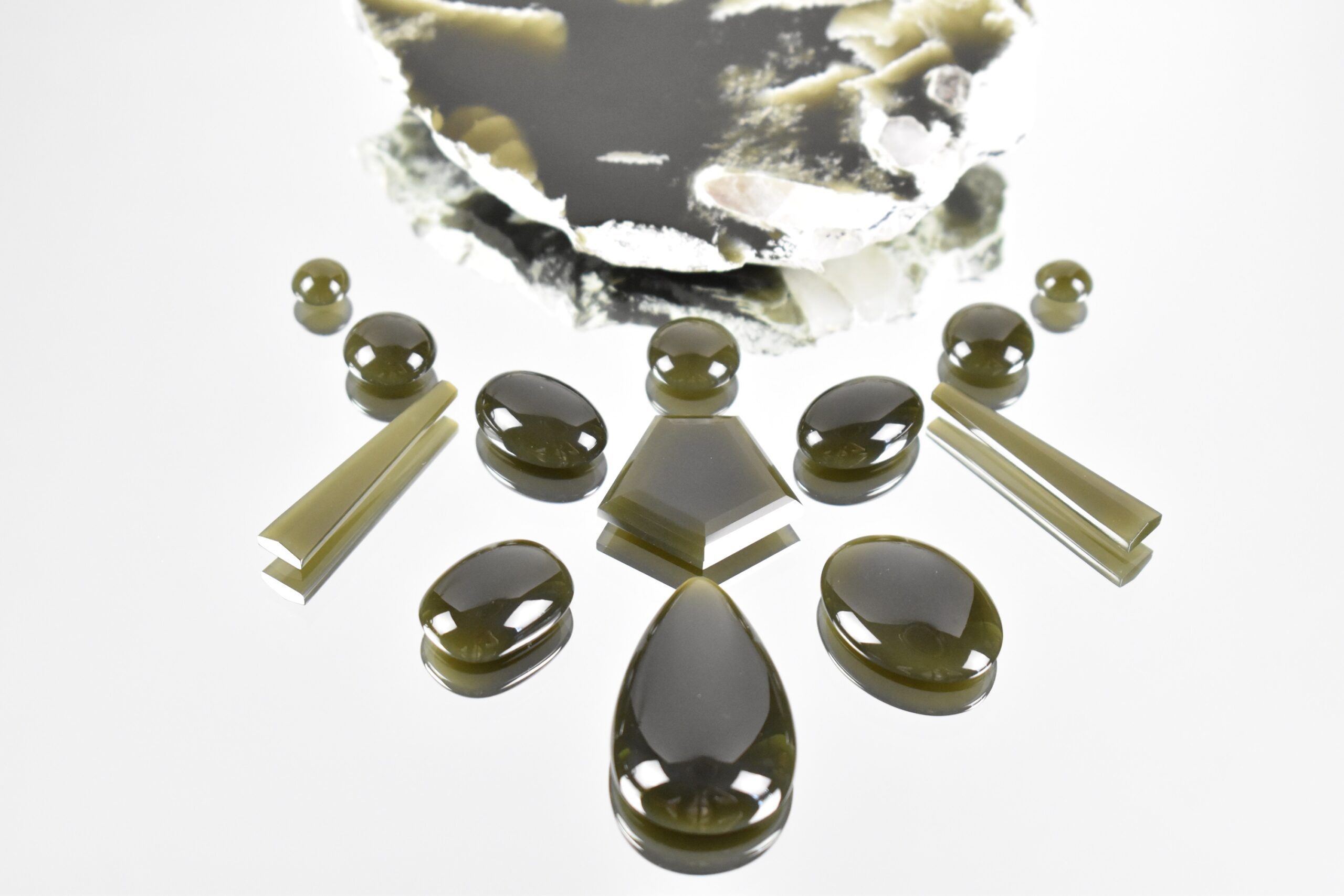 PRESS RELEASE - Gem-A Launches Spring 2024 Issue of The Journal of Gemmology Focusing on Silicified Coral from Indonesia - The Journal of Gemmology,Silicified Coral from Indonesia - Cabochon cut Wyoming nephrite up to 40.5 × 24.3 mm. Photo by J. P. Jutras scaled